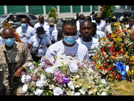 Police question presidential guards as assassination probe deepens