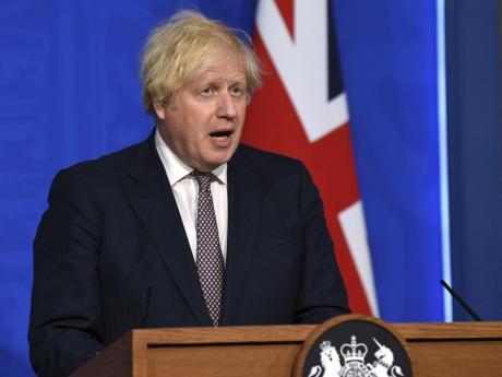 Johnson says restrictions to ease, UK must live with coronavirus