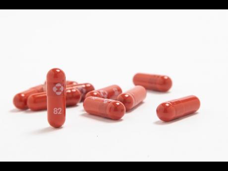UK authorises Merck antiviral pill, first shown to treat COVID