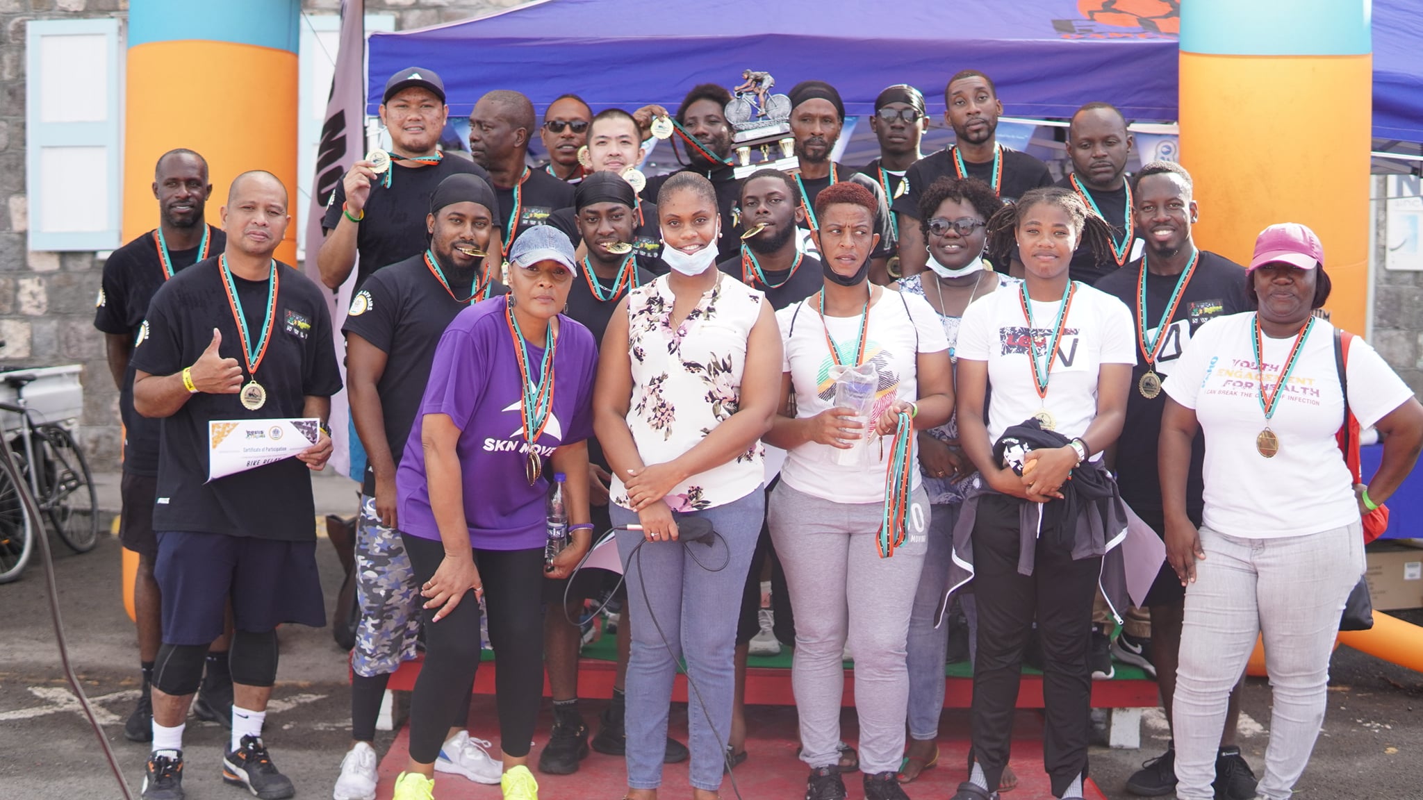 Minister Brandy-Williams Congratulates Men at Cycling Event