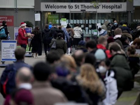 Omicron spreading so fast it threatens Britain’s hospitals