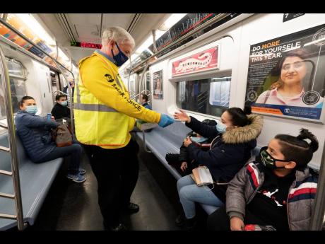 US extends mask rule for travel while weighing new approach