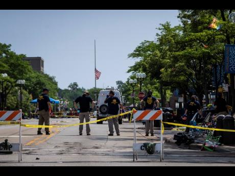 Police: Gunman fired 70-plus rounds at July 4 parade, 7 dead