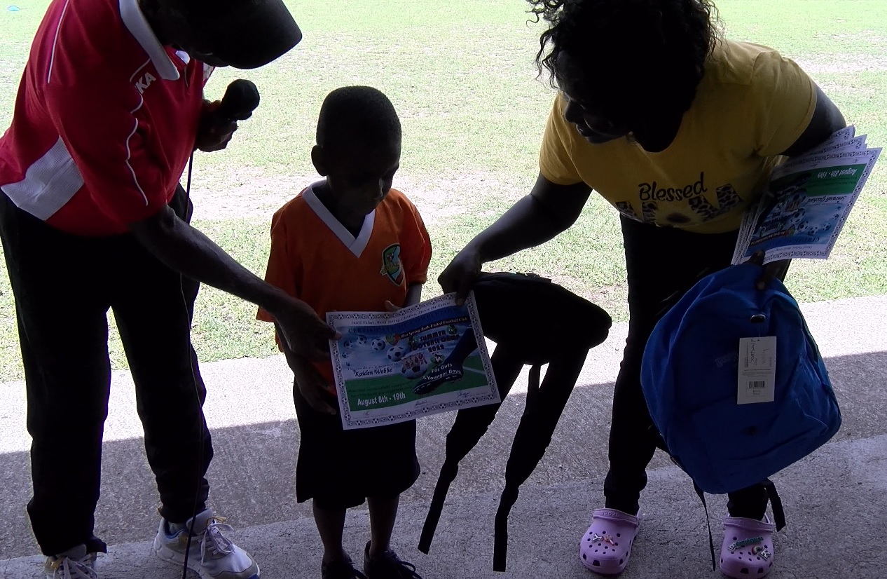 Bath United Football Club Presents Annual Gifts of School Supplies –Complements of The MV Apple Syder