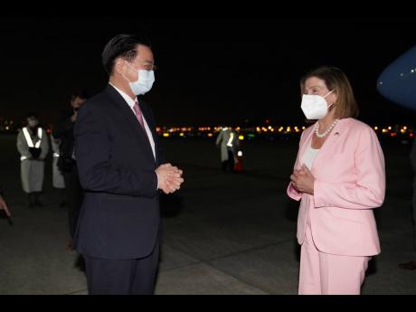 Pelosi arrives in Taiwan, defying Beijing