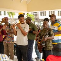 Honey Bees String Band Brings Joy and Fellowship to Residents of Flamboyant Nursing Home in Celebration of Seniors Month