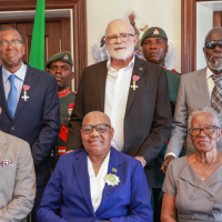 Three Nationals Recognised for Outstanding Service at Investiture Ceremony